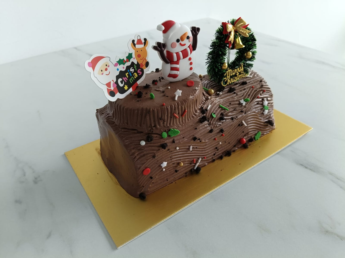Ho ho ho! Merry Christmas | 0.6kg+- Santa's Woody Delight Log Cake | $48.80 Nett